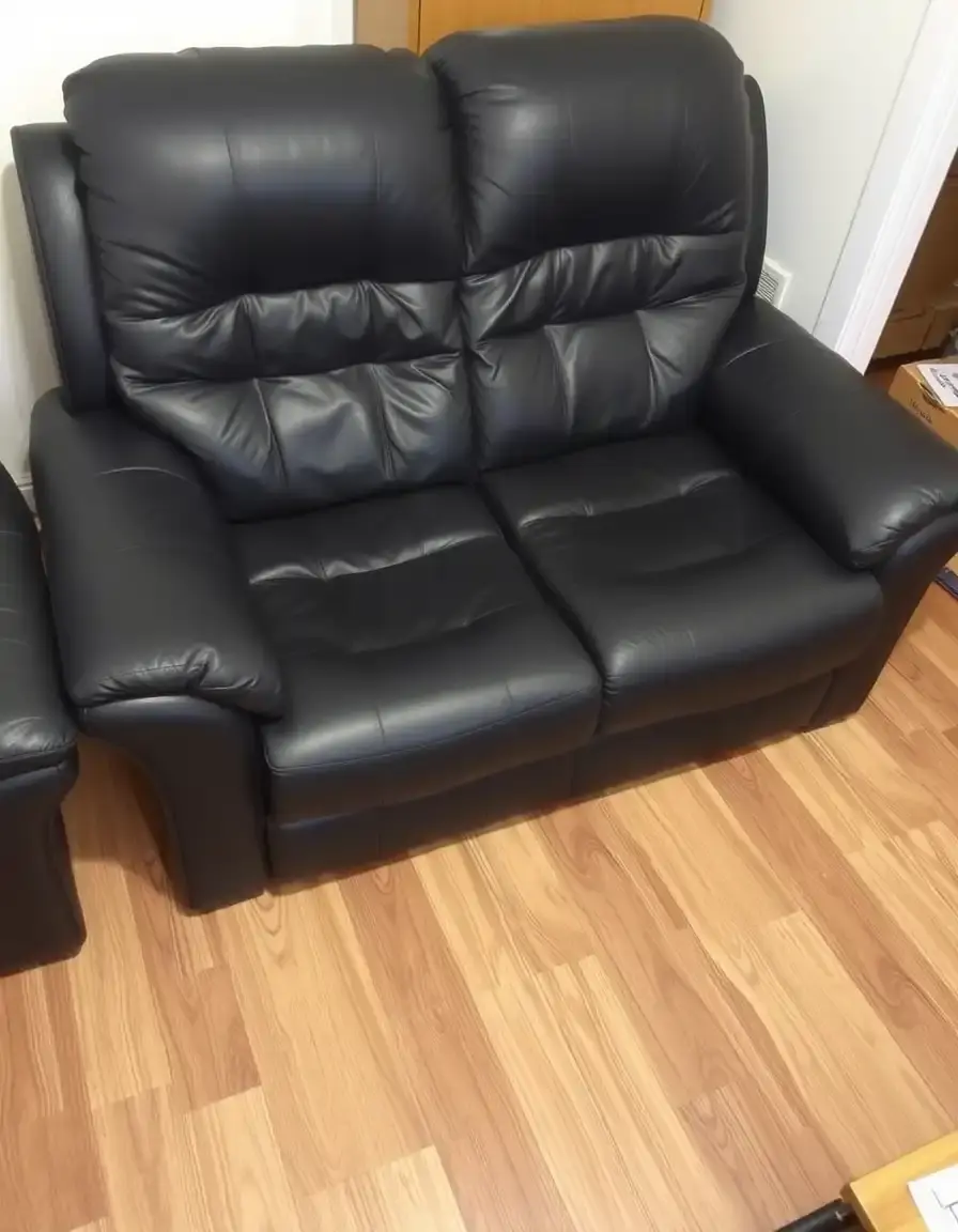 Small black leather recliner settee for compact spaces