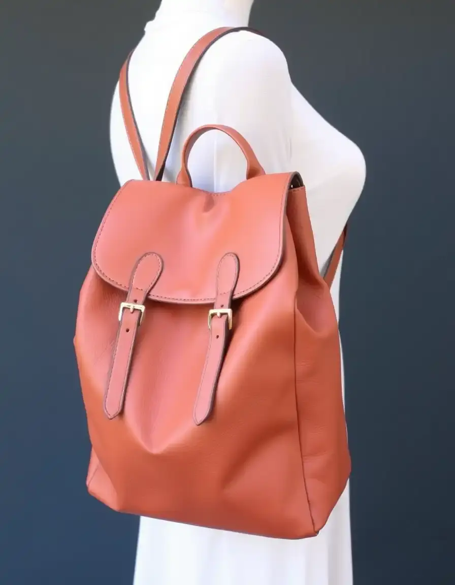 Tan large leather backpack purse showing interior space