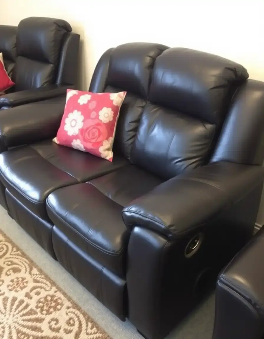 Sleek black reclining leather settee in a modern living room