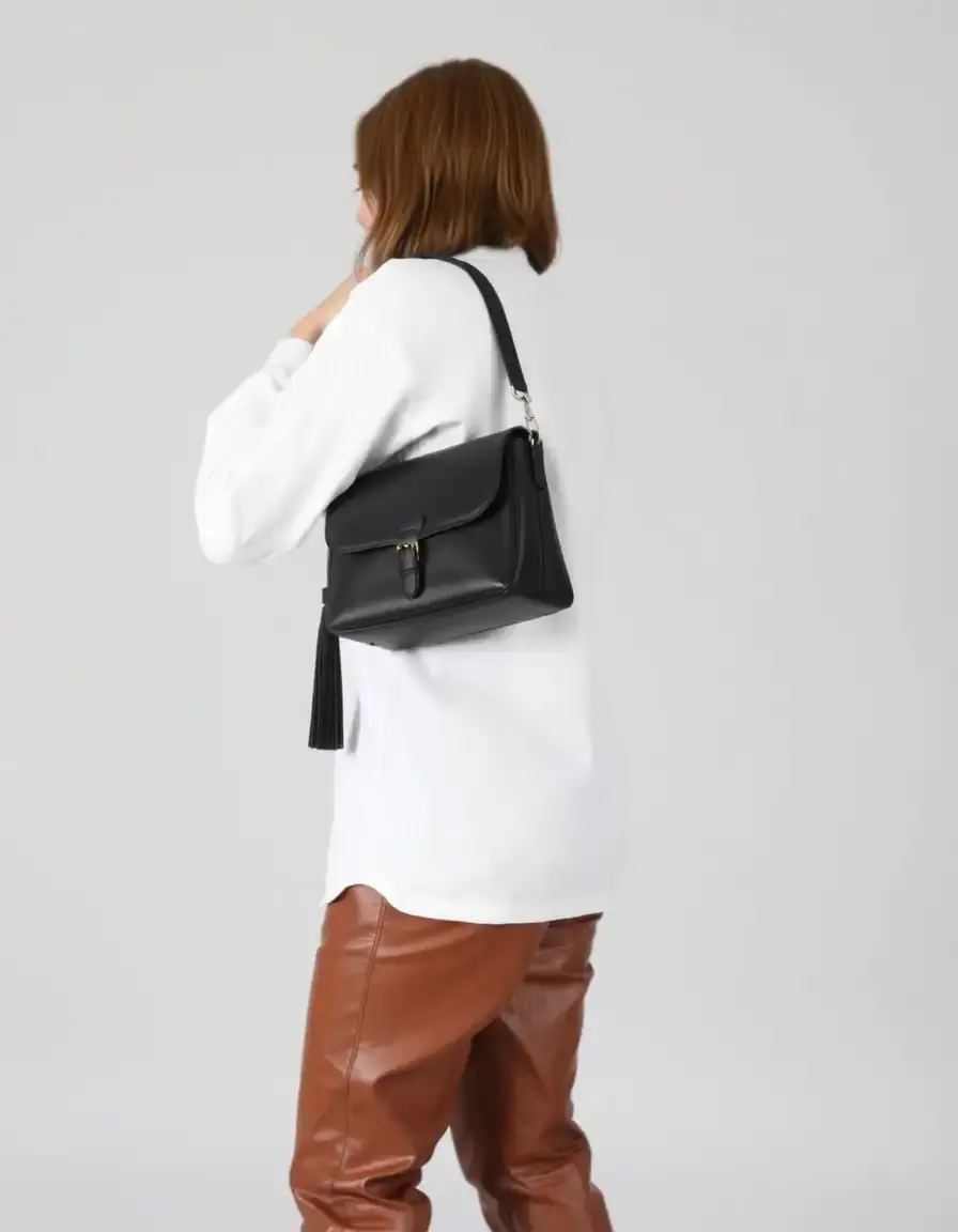 Leather pants paired with a stylish leather shoulder bag