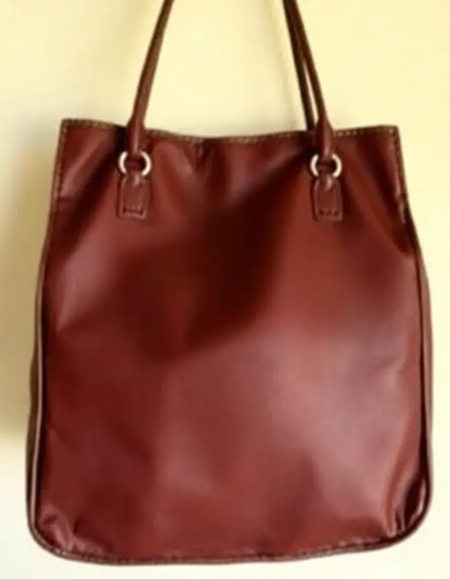 Large brown leather tote bag with ample storage space