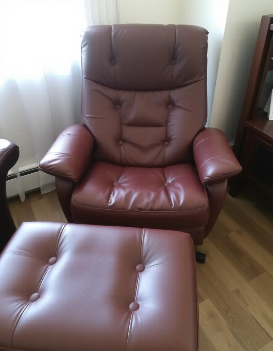 Brown leather recliner chair with ottoman in a reclined position