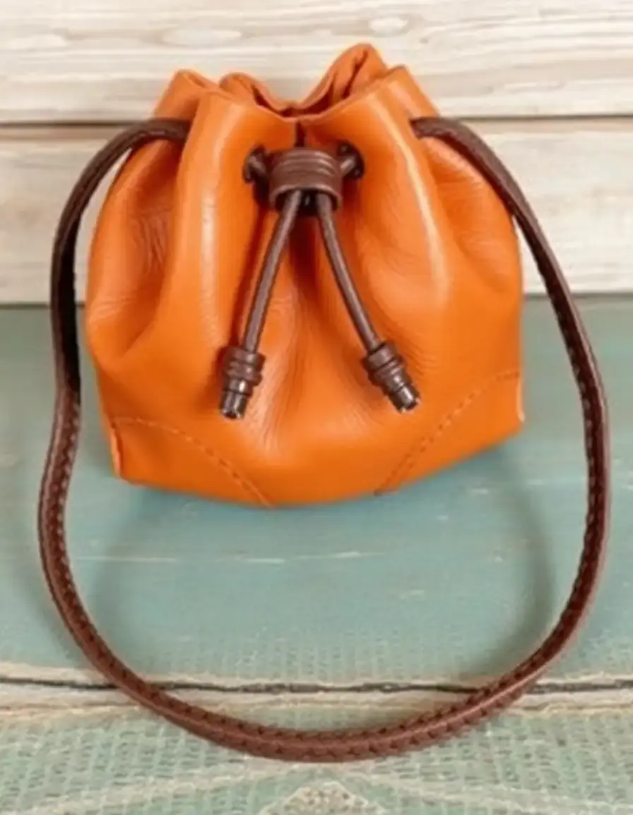 Vintage style leather coin bag in cognac, drawstring