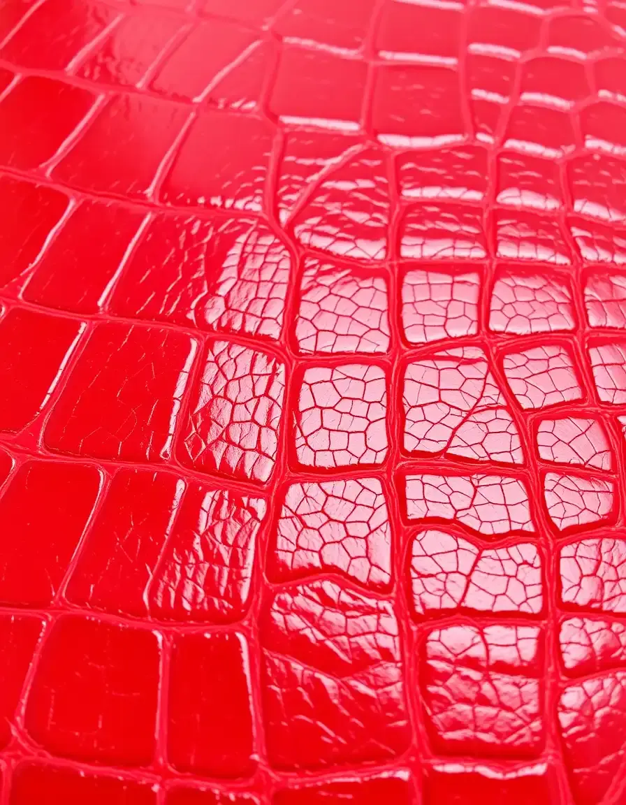 Crocodile embossed red leather texture