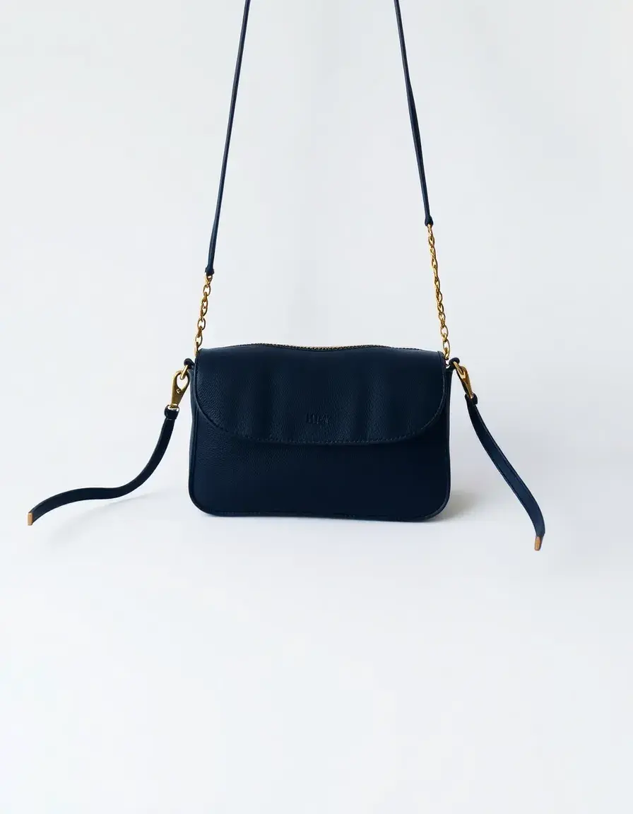 Navy leather crossbody handbag with adjustable strap