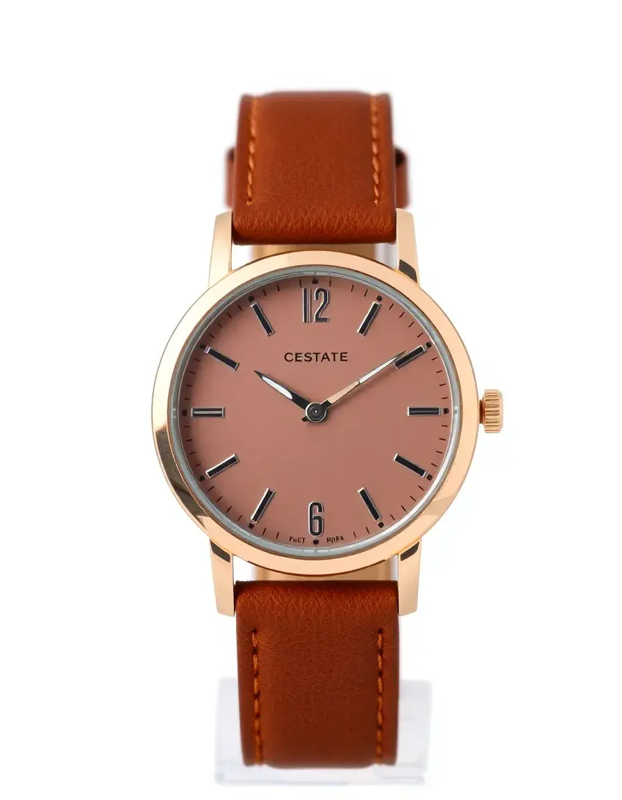 Brown leather strap analog watch for women on a wrist