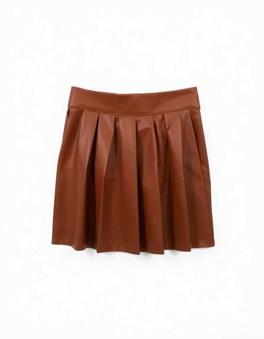 A brown pleated leather mini skirt folded neatly