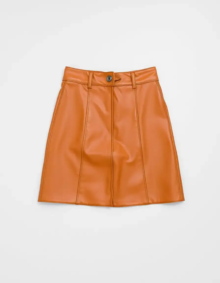 An A-line shaped tan leather mini skirt flat lay
